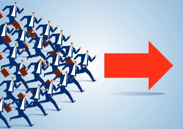 istock A group of businessmen run forward following a red arrow 1385873085