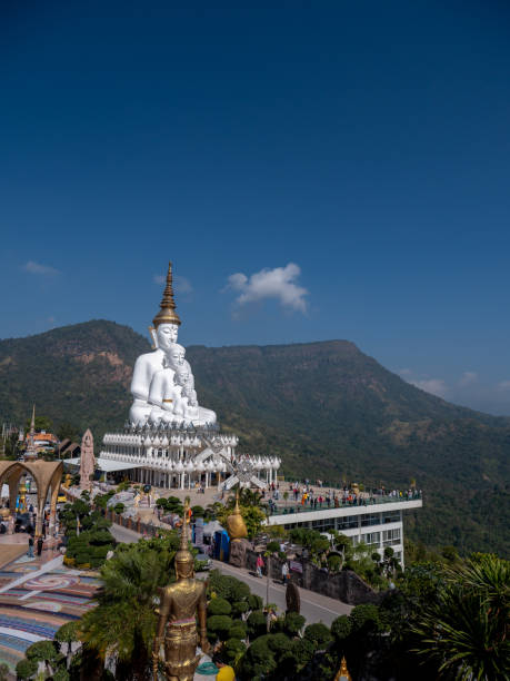 istock 5 White Buddha Statues Sitting on The Hill 1385874791