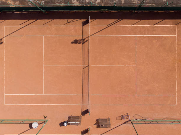 istock young man playing tennis 1385876084
