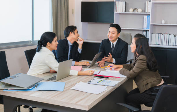istock young manager man and staff working on business corporate strategy 1385878219