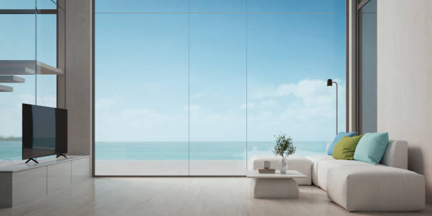 istock Modern beach house living interior with sea view from the window.3d rendering 1385884850