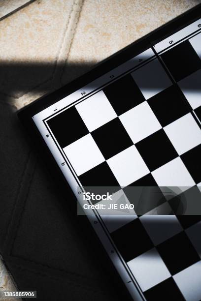 A Chessboard In The Sun Stock Photo - Download Image Now - Advice, Below, Board Game