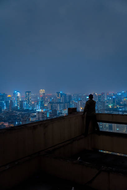 istock A man who shoots scenery with his mobile phone at high altitude at night 1385886463