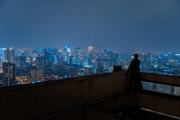 istock A man who shoots scenery with his mobile phone at high altitude at night 1385886467