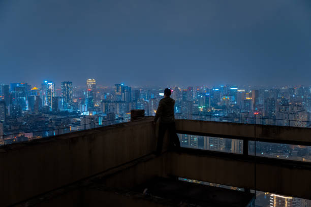 istock A man who shoots scenery with his mobile phone at high altitude at night 1385886469