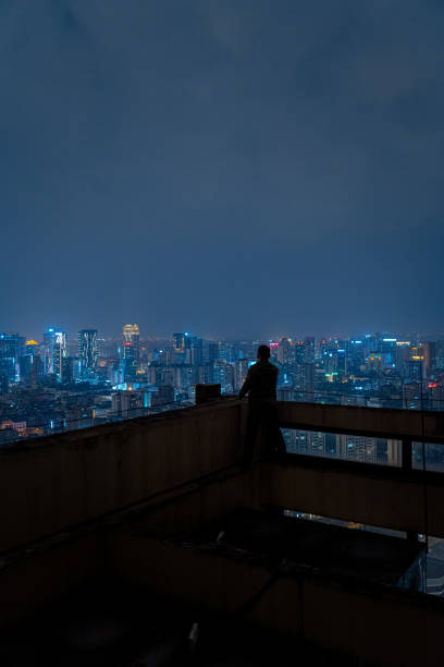 istock A man who shoots scenery with his mobile phone at high altitude at night 1385886471