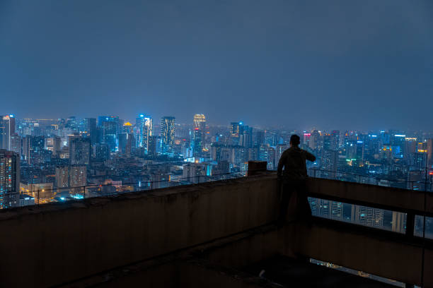 istock A man who looks at the scenery at high altitude at night 1385886490