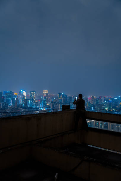 istock A man who shoots scenery with his mobile phone at high altitude at night 1385886507