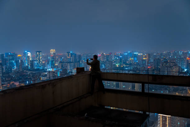 istock A man who shoots scenery with his mobile phone at high altitude at night 1385886509