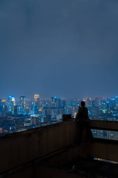 istock A man who looks at the scenery at high altitude at night 1385886512