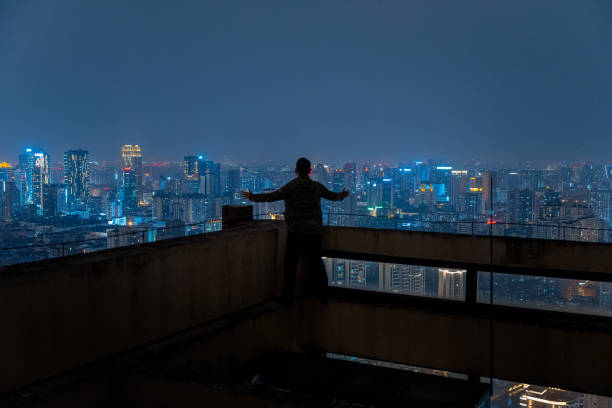 istock A man who looks at the scenery at high altitude at night 1385886565