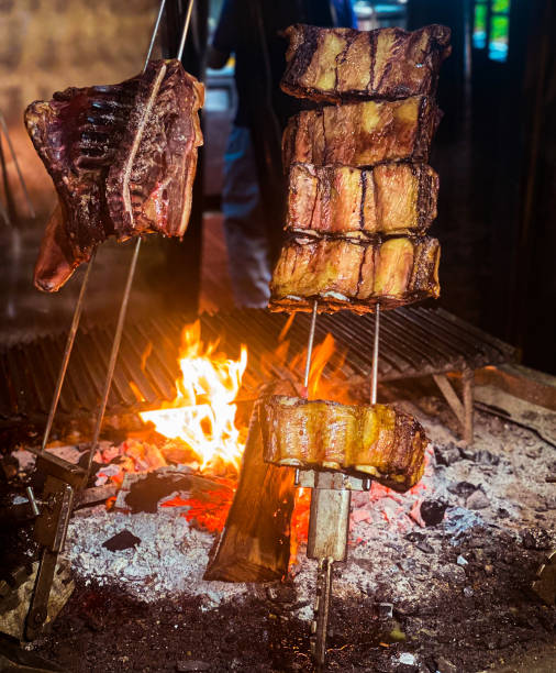 istock Cooking short ribs on a traditional coal pit 1385893834