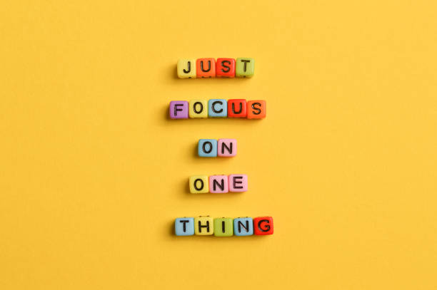istock Alphabet letters with text JUST FOCUS ON ONE THING. Motivational quote. 1385901888