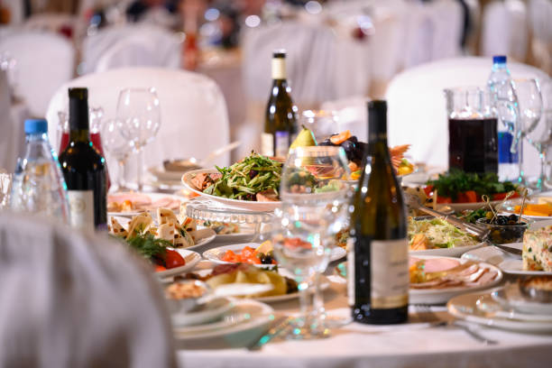 istock Plates with cold snack on table, cutlery for dinner, white napkin, selective focus. 1385905275