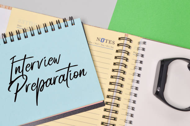 istock Top view of notebook written with INTERVIEW PREPARATION. 1385906022