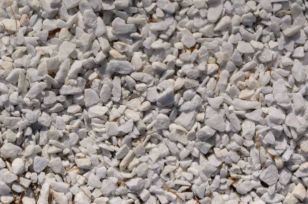 istock White stone gravel background texture. 1385907153