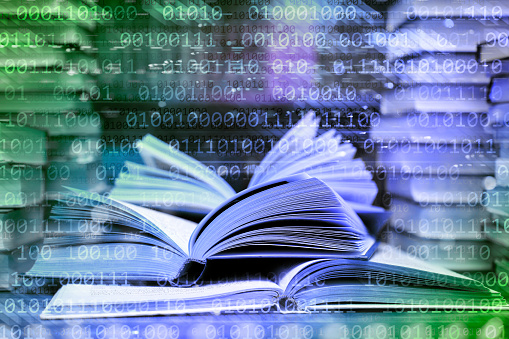 Close-up of a book on a binary code abstract background. Can illustrate the concept of e-books, online reading, e-learning, online education etc.