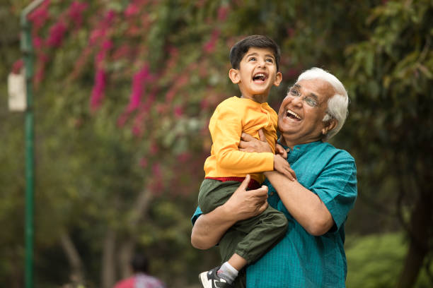 istock Old man enjoying with grandson at park 1385908209