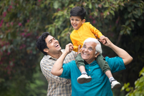 istock Three generation family having fun at park 1385908332