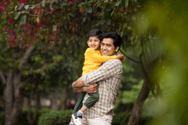 istock Father with son admiring view at park 1385908425