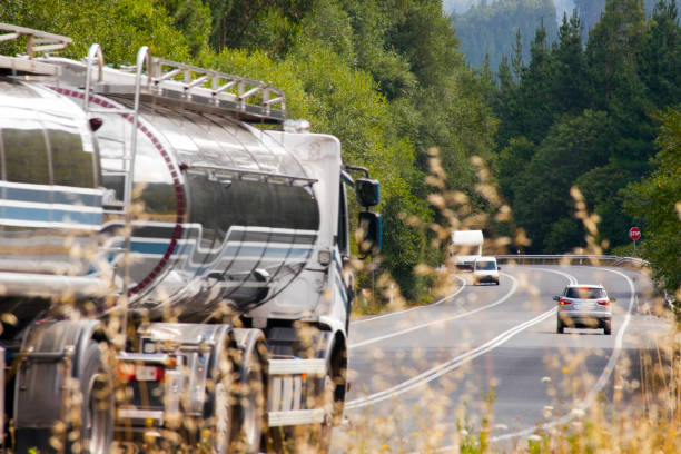 country road traffic in summertime, tank truck. - semi skimmed milk imagens e fotografias de stock