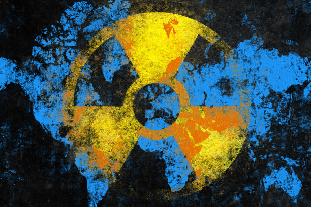 nuclear danger symbol with world map - nuclear war imagens e fotografias de stock