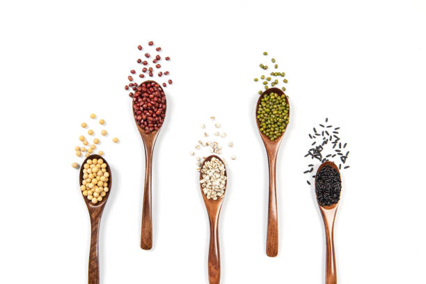 istock veriety natural organic cereal and grain seed in spoon on white background 1385911065