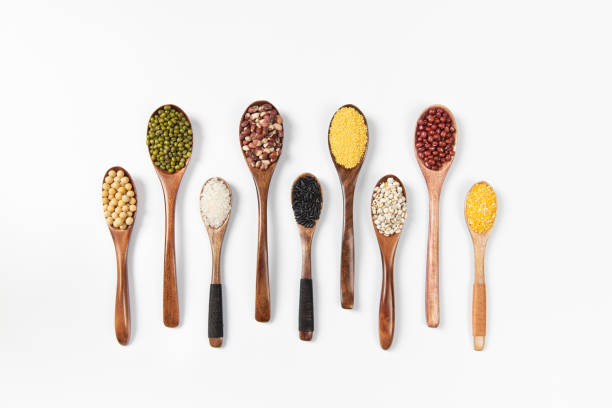 istock veriety natural organic cereal and grain seed in spoon on white background 1385911178