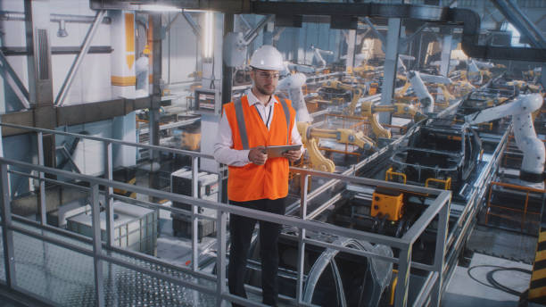 istock Male engineer working on car factory 1385911338