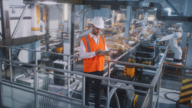 istock Male engineer working on car factory 1385911457