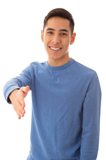 笑顔のヤングアダルト男性が握手を交わす - greeting teenager handshake men ストックフォトと画像