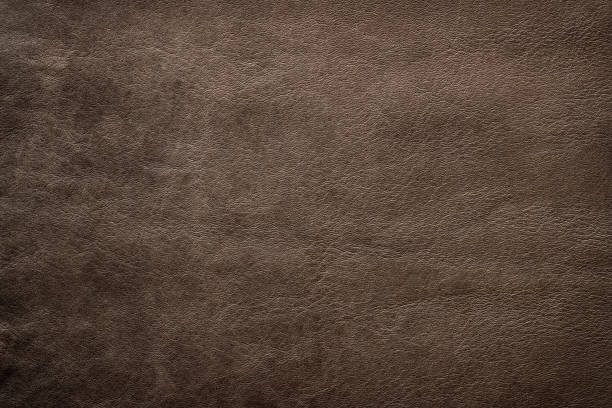 istock Brown leather texture background. Dark genuine leather 1385922576