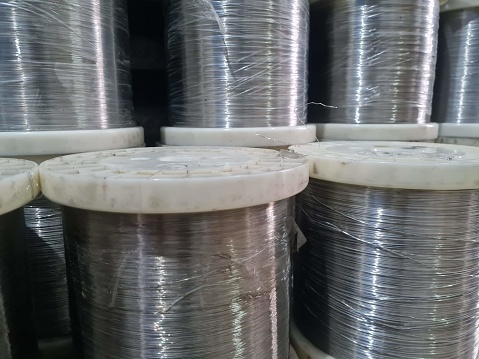 stainless wire stock in coils in industrial tool shop