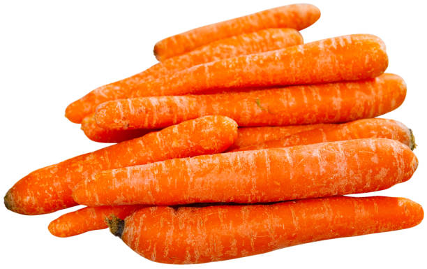 istock Raw unpeeled carrots on wooden table 1385928399