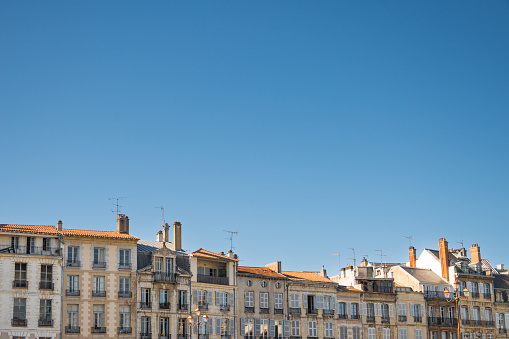 Residential buildings facades and rooftops with copy space