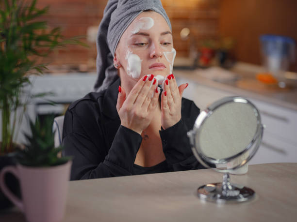 istock woman Enjoying flawless skin . 1385934533