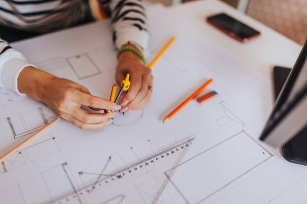 istock Drawing blueprint at home office 1385939636