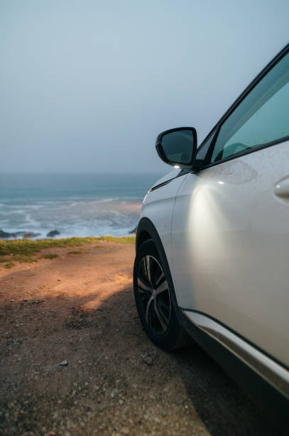 istock Car parked by the sea 1385942637