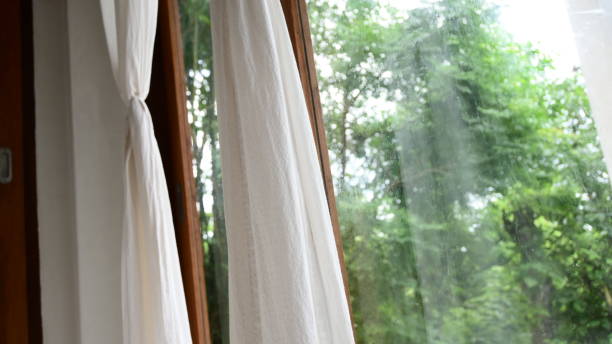 istock white curtain in the room with natural background 1385944511
