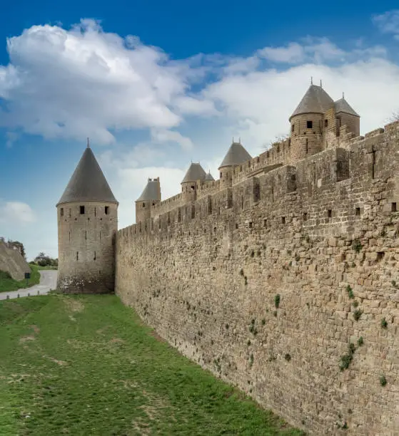 Photo of Ruins of the fortified medieval citadel of Carcassone, Aude, Occitanie, France. An imposing UNESCO World Heritage Site