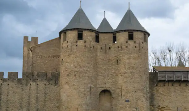 Photo of Ruins of the fortified medieval citadel of Carcassone, Aude, Occitanie, France. An imposing UNESCO World Heritage Site