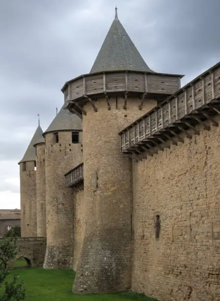 Photo of Ruins of the fortified medieval citadel of Carcassone, Aude, Occitanie, France. An imposing UNESCO World Heritage Site