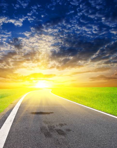 istock asphalt road at the sunset 1385944670