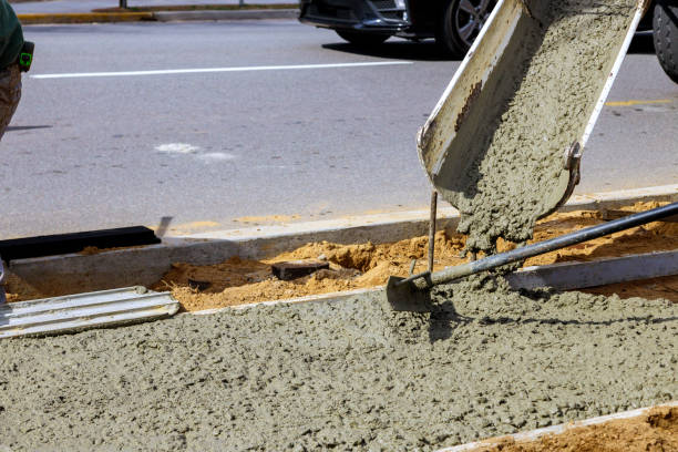 istock Workers concrete mixer with pouring cement during to residential on sidewalk 1385945065
