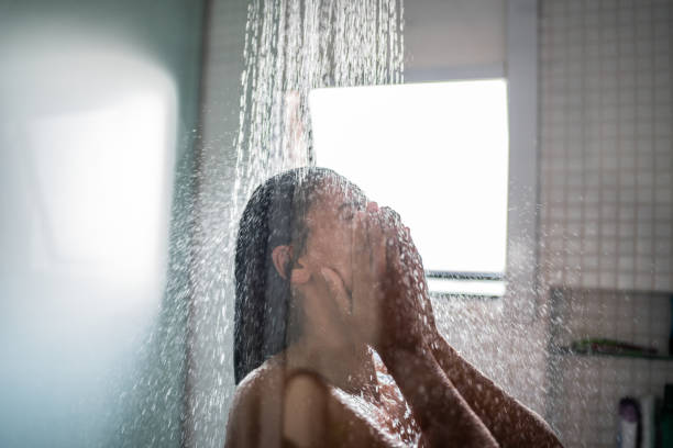 istock Woman taking a shower at home 1385946677