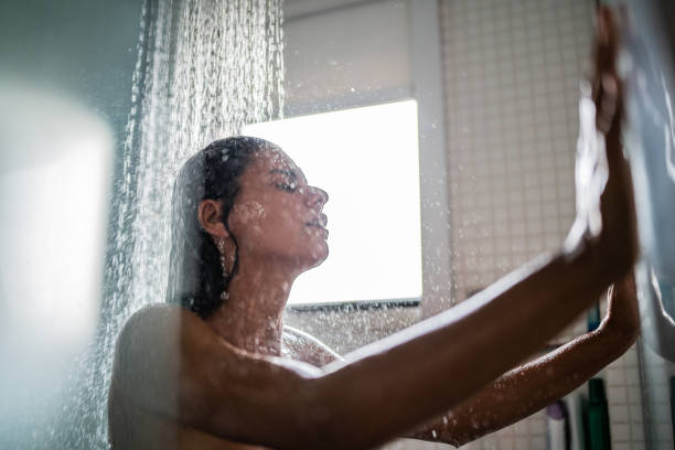istock Woman taking a shower at home 1385946681