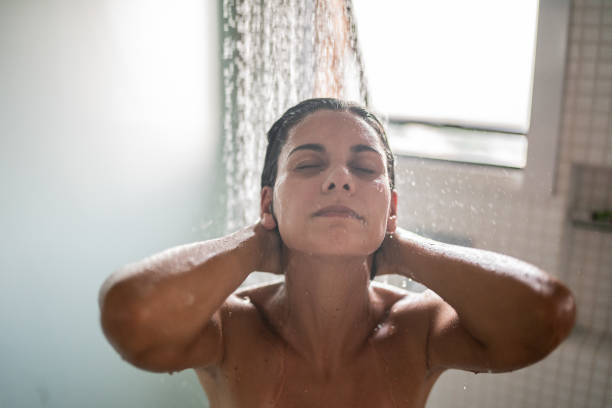 istock Woman taking a shower at home 1385946715