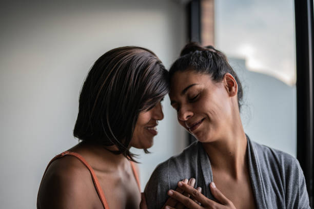 istock Lesbian couple on affection moment at home 1385946904