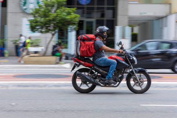 food delivery guy on Paulista avenue stock photo