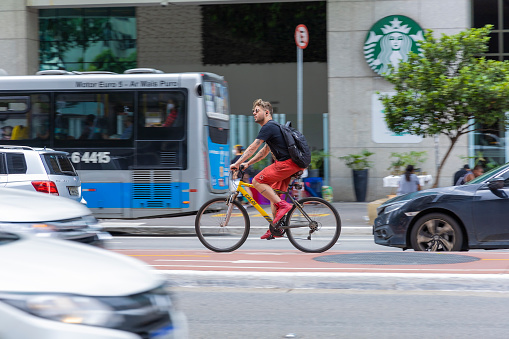 São Paulo, SP, Brazil, MAR 12 2022, cyclists ride on the bike lane on Paulista avenue